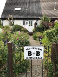 Looking up the garden to Baba's Rooms Accommodation